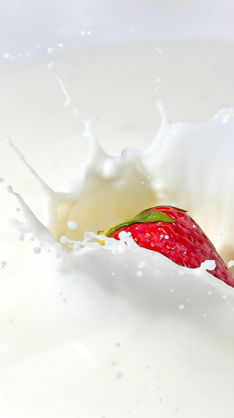 Strawberry splashing in milk wallpaper 480x854
