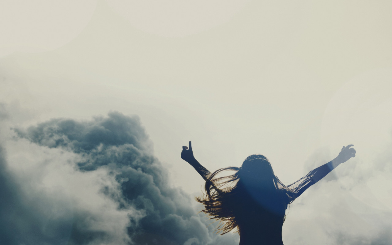 Girl silhouette above clouds wallpaper 1280x800