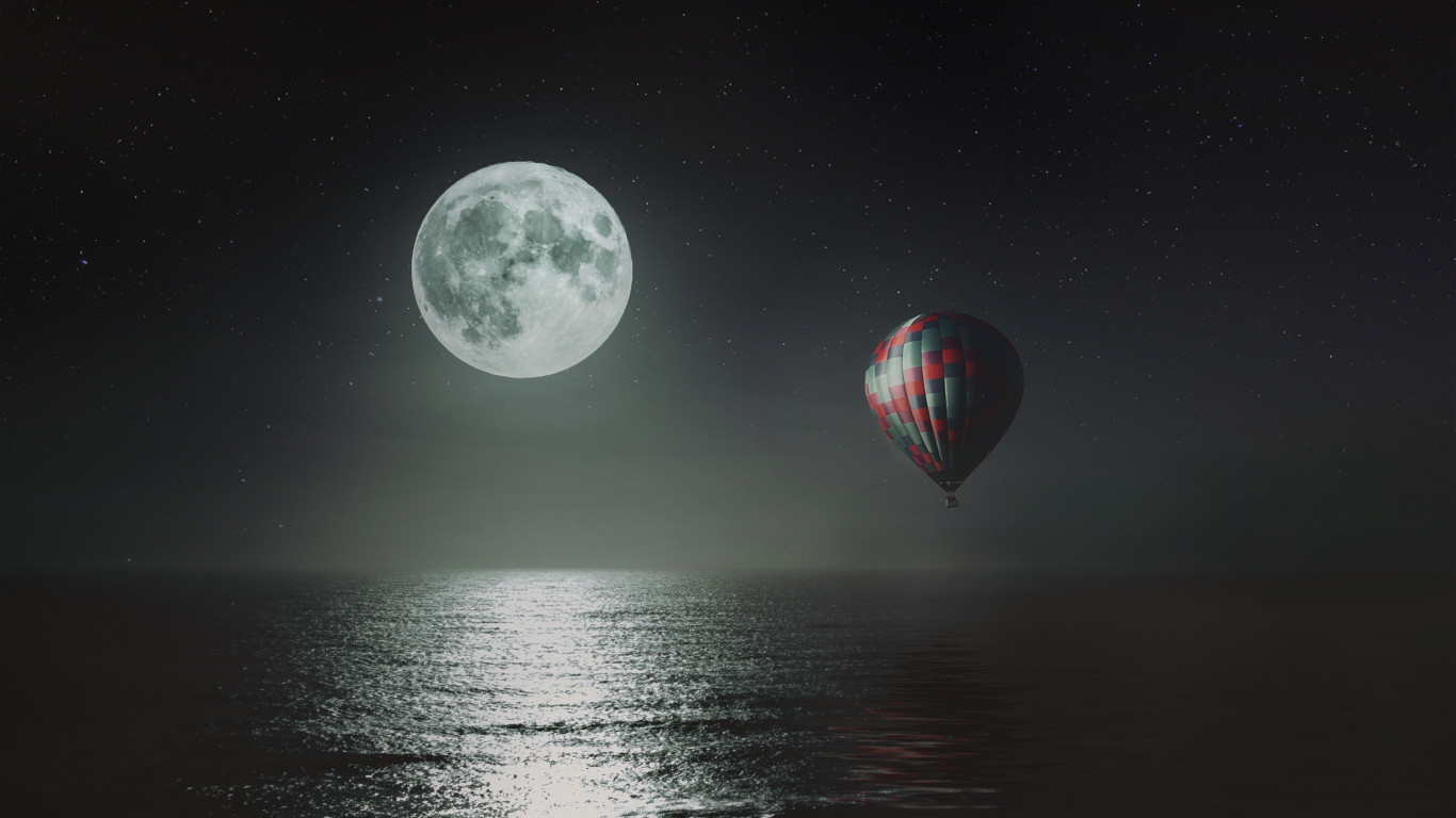 Hot air balloon over the night sky wallpaper 1366x768