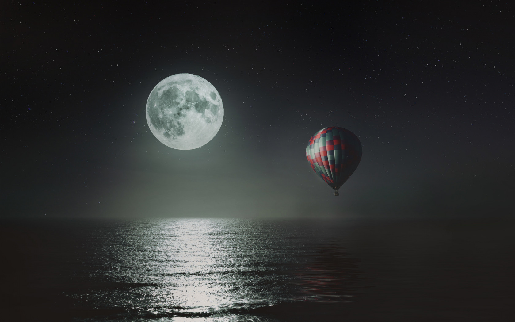 Hot air balloon over the night sky wallpaper 1680x1050