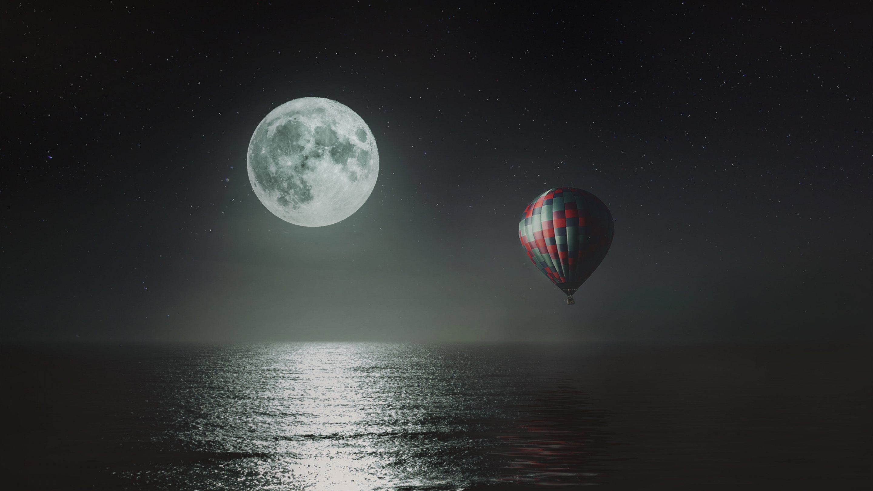 Hot air balloon over the night sky wallpaper 2880x1620