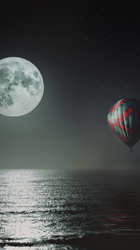 Hot air balloon over the night sky wallpaper 480x854