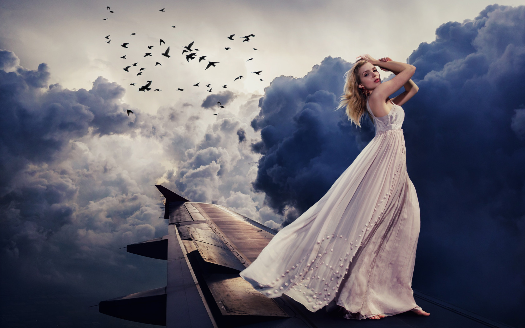 Beautiful girl on the airplane wing wallpaper 1680x1050