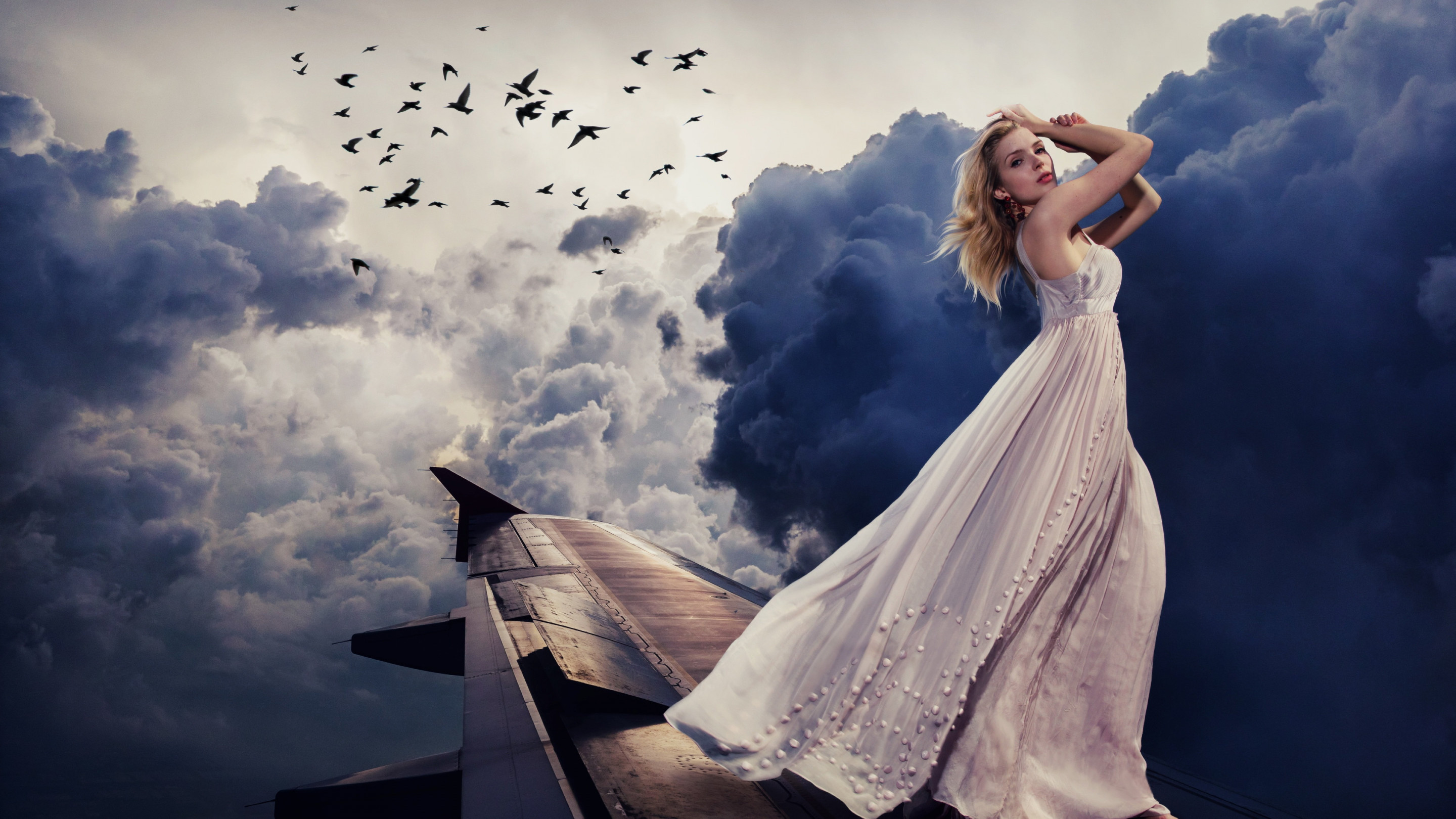 Beautiful girl on the airplane wing wallpaper 2880x1620