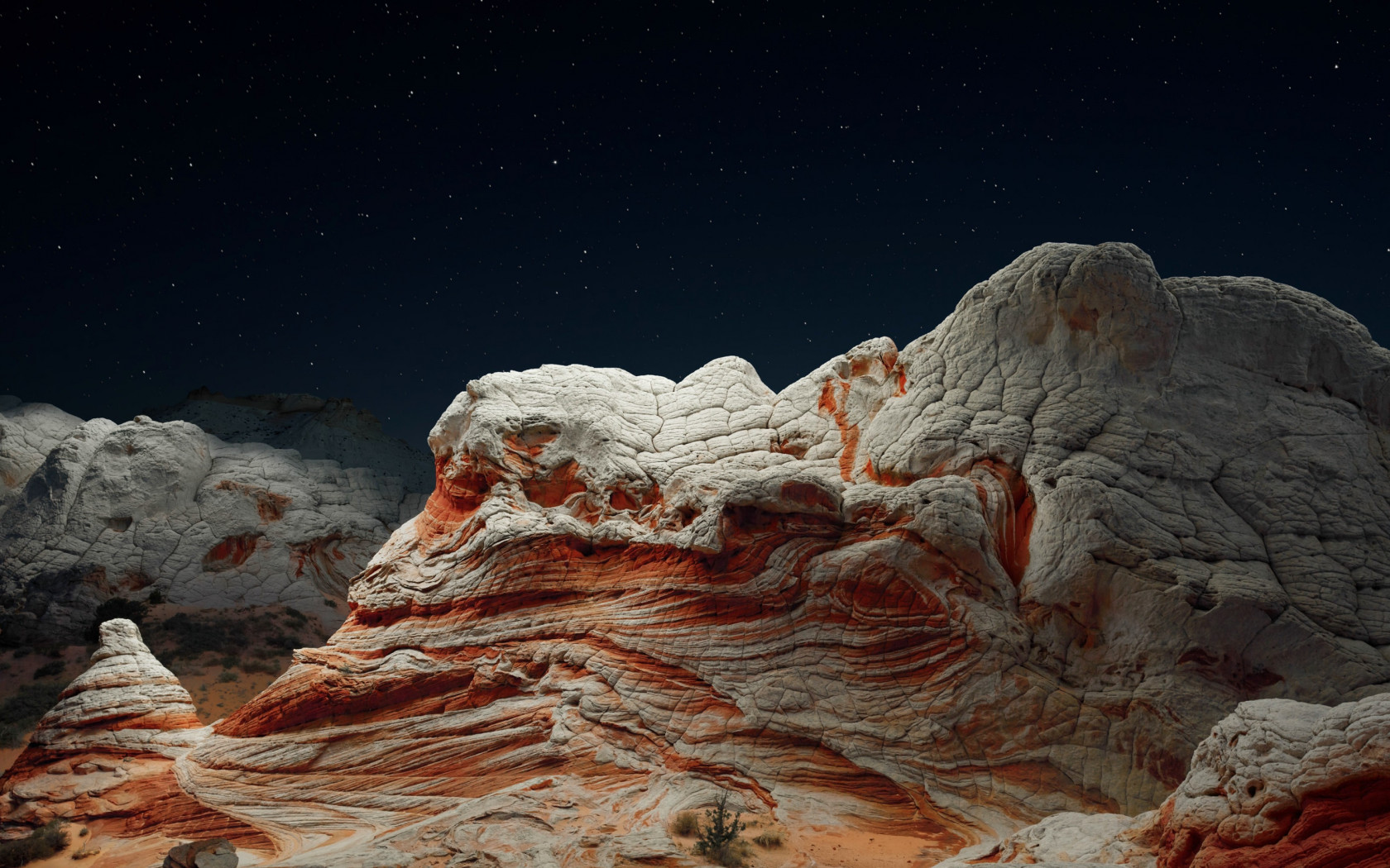 The night sky and desert valley wallpaper 1680x1050